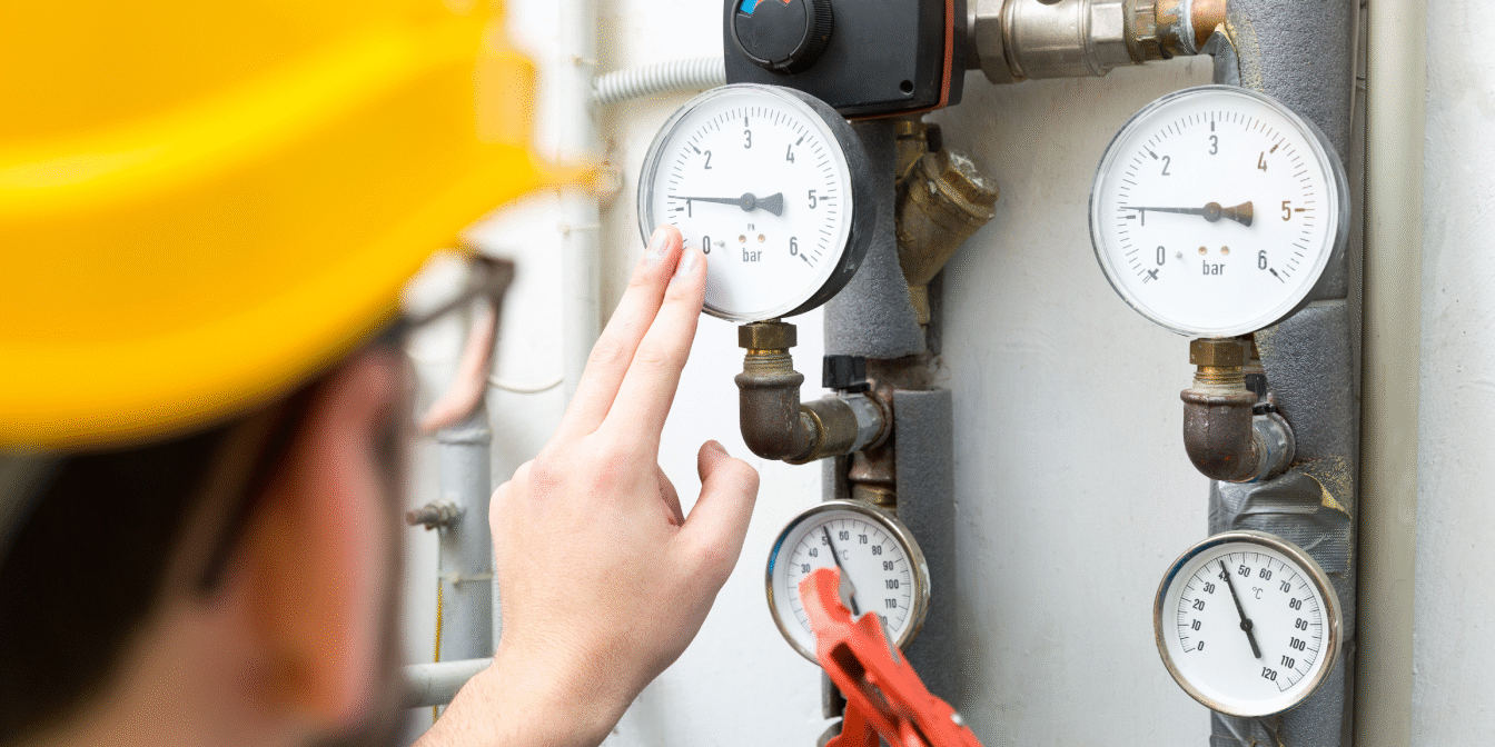 Technician Checking Low Water Pressure in a Boiler System
