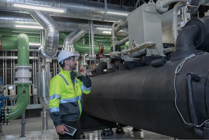 Man Inspecting Boiler Room