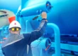 Burner tune-up services — technician inspecting industrial gas fuel line