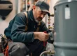 Commercial boiler repair AZ technician inspecting valve connections in a boiler room