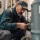 Commercial boiler repair AZ technician inspecting valve connections in a boiler room