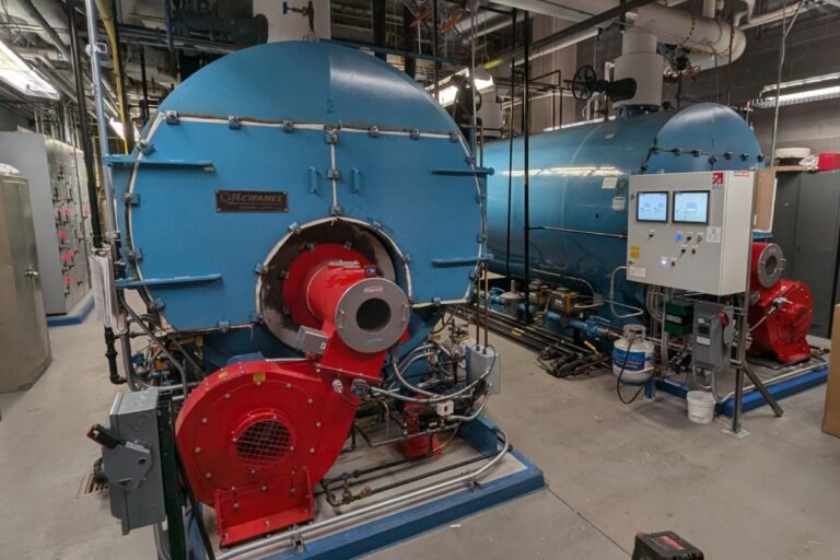 Water treatment for commercial boilers in an Arizona facility showing Kewanee boilers with burner assembly and control panel